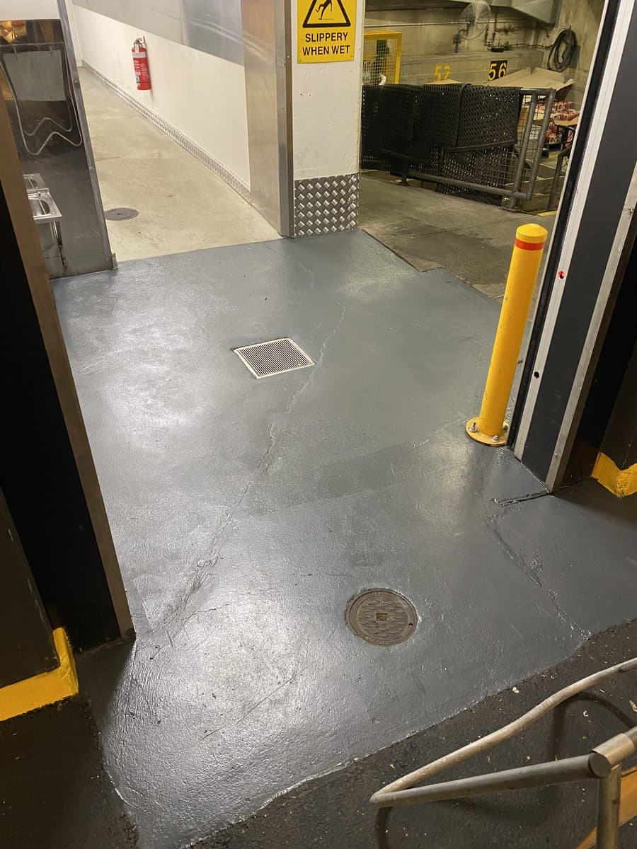 Epoxy floor coating in commercial loading dock by ADs Maintenance Adelaide