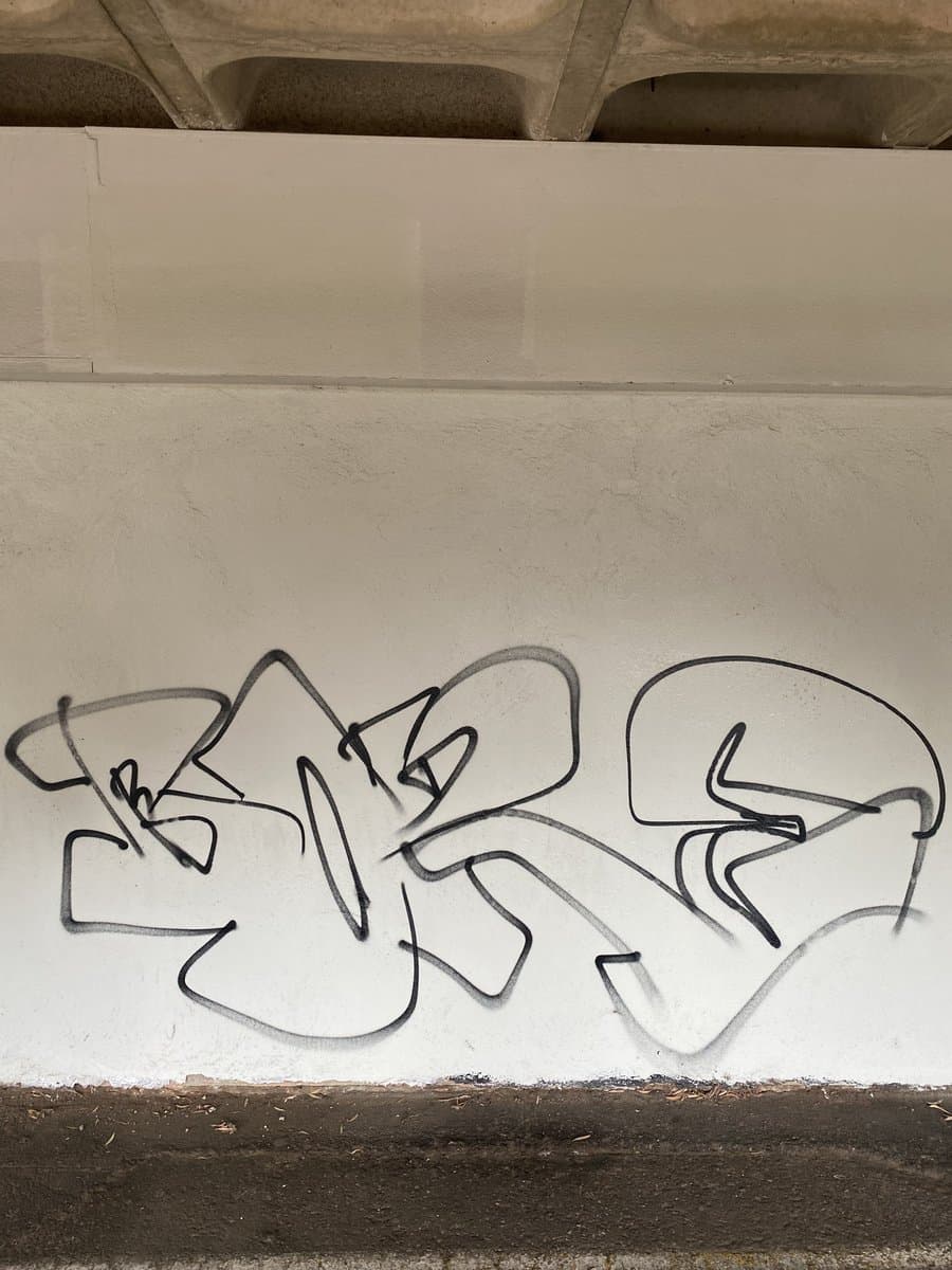 Graffiti removal and wall restoration on commercial building by ADs Maintenance Adelaide - Before